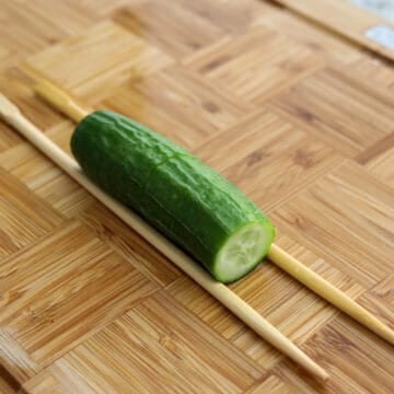 cucumber between chopsticks
