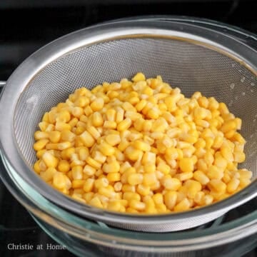 Strain canned corn of the excess water and discard the water. Transfer strained corn to a large bowl. 