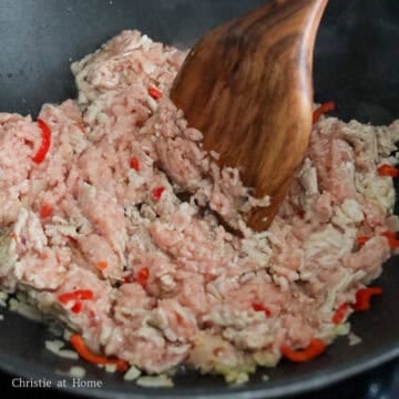 Add ground meat into the pan. Break up ground meat into smaller pieces (not chunks).