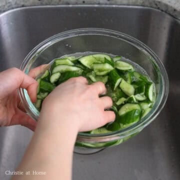 Rinse cucumbers under cold running water to remove excess salt or it'll be too salty. 