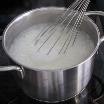 At 22-minute mark, use a whisk and rapidly stir the rice until it breaks down, about 1-2 minutes. If you don't own a whisk, you can also use an immersion blender or allow this to cook for another 20-30 minutes until the rice breaks down on its own.