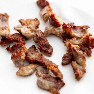 Remove and transfer the cooked pork to a wire rack or a paper-towel lined plate to drain off excess oil. 