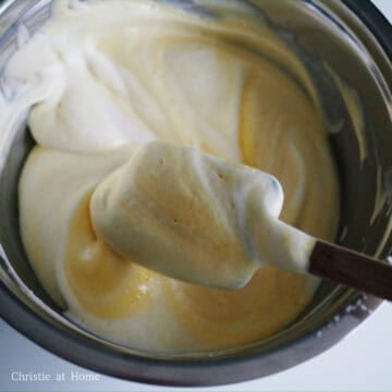 Gently whisk meringue into the batter starting with one dollop to loose batter. Then add the rest and whisk batter 5-6 times. Then softly fold with a spatula until combined. Do not over mix the batter.