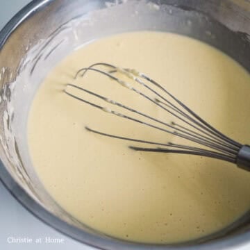 To make the bread batter: whisk together all-purpose flour, white granulated sugar and baking powder until combined in a large mixing bowl. Then whisk in the egg, vanilla extract, milk and melted butter and mix just until combined. Do not over mix. 