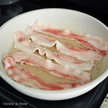 On medium-high heat, cook your pork belly until it's no longer pink and some of the fat has rendered off, about 4-5 minutes. Remove and place the pork belly strips on a plate lined with paper towel to soak up excess grease.