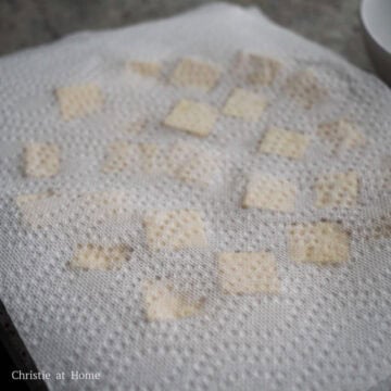 Pat dry the tofu cubes with clean paper towels to remove excess moisture. This is important or your coating will fall off.