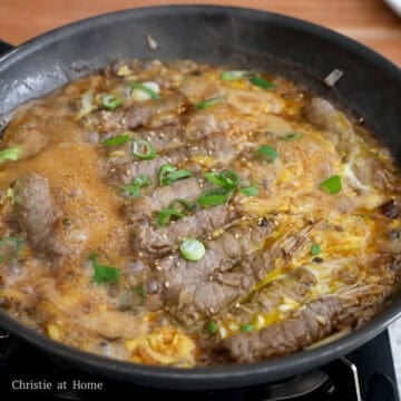 Pour the beaten eggs in a circular motion over the beef rolls and cook for another 1-2 minutes or until your desired consistency. Garnish with green onions and sesame seeds. Enjoy hot with steamed rice. 