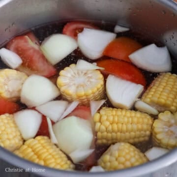 Add vegetables and water to the pot.